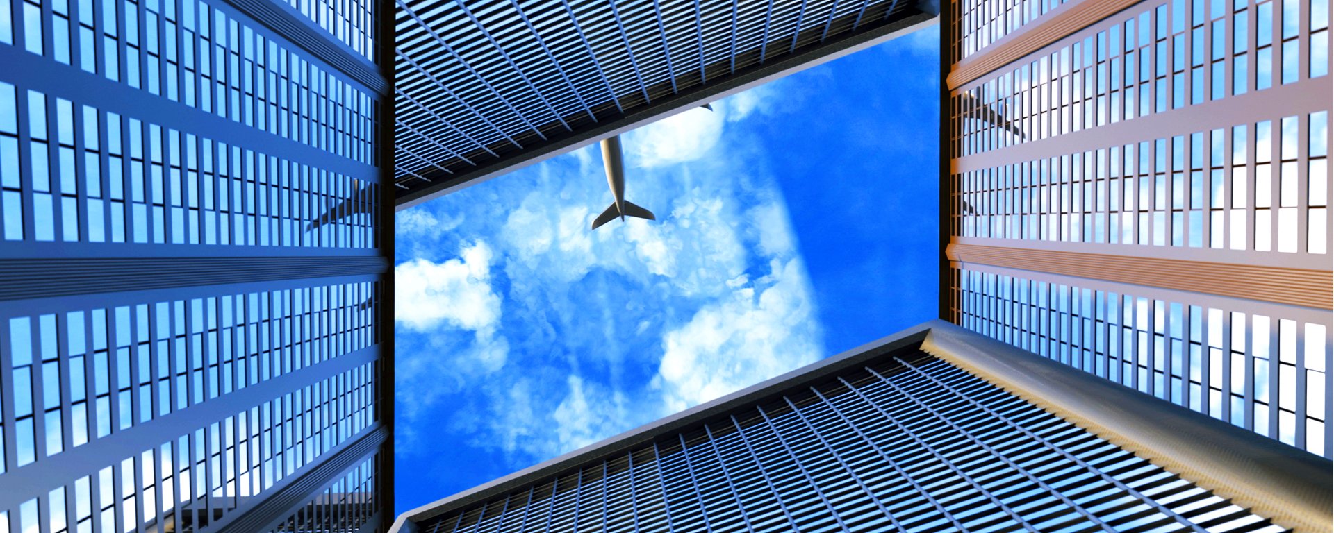 Airplane flying over buildings.