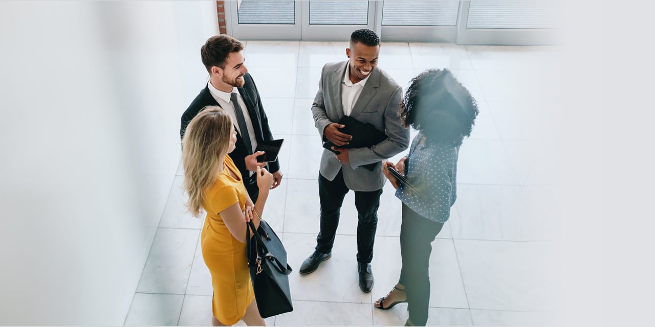 Group of people speaking in an office