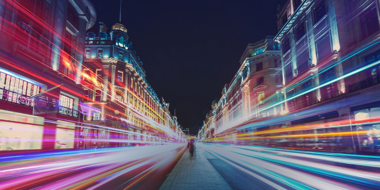 City street with open shutter photo of lights from passing cars.